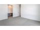 Bright bedroom with gray carpet and adjacent vanity area at 2501 Indigo Mountain St, Henderson, NV 89044