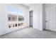 This bedroom offers a modern design, natural light, carpeted floor and a closet for storage at 2501 Indigo Mountain St, Henderson, NV 89044