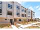 Modern townhome exterior with landscaped front yards, stone accents, and inviting walkways at 2501 Indigo Mountain St, Henderson, NV 89044