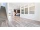 Open-concept living area with wood floors and natural light, seamlessly connecting to the kitchen at 2501 Indigo Mountain St, Henderson, NV 89044