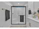 Modern bathroom features a glass-enclosed shower with white tiling and sleek fixtures at 2699 Chance Canyon St, Henderson, NV 89044