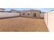 Low maintenance backyard with gravel landscaping and a fresh white fence at 2727 Avril Point St, Las Vegas, NV 89156
