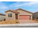 Charming single-story home with a well-manicured yard and appealing desert landscaping at 2727 Avril Point St, Las Vegas, NV 89156