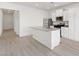 Bright kitchen featuring stainless steel appliances, a kitchen island, and sleek white cabinetry at 2727 Avril Point St, Las Vegas, NV 89156