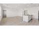 Spacious living room featuring wood-look floors adjacent to the kitchen at 2727 Avril Point St, Las Vegas, NV 89156
