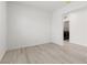 Neutral room featuring wood-look floors and plenty of natural light from doorway to laundry room at 2727 Avril Point St, Las Vegas, NV 89156