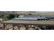 Rooftop view of a covered patio showcasing a wooden deck, solar panels, and beautiful desert mountain views at 275 Vegas Dr, Goodsprings, NV 89019