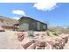 Quaint home with beautiful desert landscaping, offering a serene and picturesque setting with mountain views at 275 Vegas Dr, Goodsprings, NV 89019
