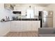 Cozy kitchen with white cabinets, black countertops, and modern appliances at 275 Vegas Dr, Goodsprings, NV 89019