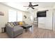 Bright living room with a comfortable sectional sofa, modern ceiling fan, and updated flooring throughout at 275 Vegas Dr, Goodsprings, NV 89019