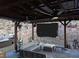 Inviting outdoor living space features a covered patio, comfortable seating, and a large screen for entertaining at 275 Vegas Dr, Goodsprings, NV 89019