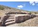 Stone patio and steps create an inviting outdoor space perfect for relaxation and enjoying the serene desert setting at 275 Vegas Dr, Goodsprings, NV 89019