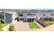 An aerial view of the backyard with gravel, artificial turf, a brick wall, and the home's exterior at 298 Grant Ridge Dr, Henderson, NV 89012