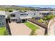 Aerial shot of a backyard with gravel, artificial turf, a brick wall, and the exterior at 298 Grant Ridge Dr, Henderson, NV 89012