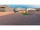 Expansive backyard with gravel landscaping and artificial turf, providing a low-maintenance and enjoyable outdoor space at 298 Grant Ridge Dr, Henderson, NV 89012