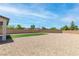 View of a backyard featuring a gravel area with a small patch of artificial turf, enclosed by a brick wall at 298 Grant Ridge Dr, Henderson, NV 89012