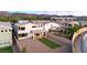 Spacious backyard features gravel landscaping, a small patch of artificial turf, and a two story home at 298 Grant Ridge Dr, Henderson, NV 89012