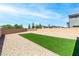 View of a backyard featuring a gravel area with a small patch of artificial turf at 298 Grant Ridge Dr, Henderson, NV 89012