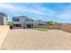 Backyard view with gravel, artificial turf, a brick wall, and the home's exterior at 298 Grant Ridge Dr, Henderson, NV 89012