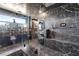 Modern bathroom featuring a glass-enclosed shower, sleek fixtures, and marble accents at 298 Grant Ridge Dr, Henderson, NV 89012