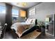 This cozy bedroom features modern decor, soft lighting, and a comfortable bed with plush bedding at 298 Grant Ridge Dr, Henderson, NV 89012