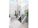 Grand foyer featuring marble floors, statement wall, soaring ceilings, and staircase at 298 Grant Ridge Dr, Henderson, NV 89012