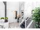 Elegant foyer with marble floors, soaring ceilings, modern staircase, and unique decor at 298 Grant Ridge Dr, Henderson, NV 89012