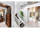 Grand foyer with a marble staircase, modern lighting, and a view of the living room at 298 Grant Ridge Dr, Henderson, NV 89012