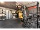 A home gym with advanced exercise equipment, storage cabinets, and fitness space at 298 Grant Ridge Dr, Henderson, NV 89012
