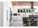 Sleek kitchen featuring marble countertops, modern appliances, white cabinetry, and wood ceilings at 298 Grant Ridge Dr, Henderson, NV 89012