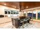 Modern kitchen featuring marble floors and countertops, an island with seating, and stainless appliances at 298 Grant Ridge Dr, Henderson, NV 89012
