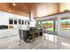 Modern kitchen with island, marble countertops, stainless steel appliances, and wood ceilings at 298 Grant Ridge Dr, Henderson, NV 89012