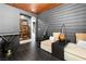 Stylish living room features wood-paneled ceiling, comfortable seating, and wood-look flooring at 298 Grant Ridge Dr, Henderson, NV 89012