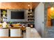 Modern living room featuring a fireplace, dark marble accents, and built-in shelves at 298 Grant Ridge Dr, Henderson, NV 89012