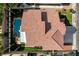 Bird's-eye view showcasing the house layout, terracotta roof, landscaping, pool, and surrounding neighborhood at 313 Vista Glen St, Las Vegas, NV 89145