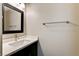 Clean half bathroom featuring modern fixtures and a framed mirror at 313 Vista Glen St, Las Vegas, NV 89145