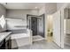 Updated bathroom featuring a soaking tub and walk-in shower with modern fixtures at 313 Vista Glen St, Las Vegas, NV 89145