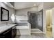 Updated bathroom featuring a soaking tub and walk-in shower with modern fixtures at 313 Vista Glen St, Las Vegas, NV 89145