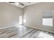 Bedroom with wood floors, natural light from windows, and a ceiling fan at 313 Vista Glen St, Las Vegas, NV 89145