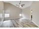 Bedroom with wood floors, natural light from windows, and a ceiling fan at 313 Vista Glen St, Las Vegas, NV 89145