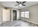Bedroom offers gray wood-look floors, bright window and closet at 313 Vista Glen St, Las Vegas, NV 89145