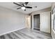 Bedroom offers gray wood-look floors, ceiling fan and closet at 313 Vista Glen St, Las Vegas, NV 89145
