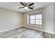 Bedroom with modern gray wood-look flooring and bright window at 313 Vista Glen St, Las Vegas, NV 89145