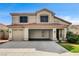 Charming two-story home with a tile roof, spacious three-car garage, and well-manicured front lawn at 313 Vista Glen St, Las Vegas, NV 89145
