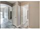Hallway view with gray wood-look flooring with modern doors and archway at 313 Vista Glen St, Las Vegas, NV 89145