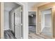 Hallway offers gray wood-look floors and access to rooms with modern doors at 313 Vista Glen St, Las Vegas, NV 89145