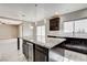 Open concept kitchen with large island, stainless steel wine fridge, and modern lighting at 313 Vista Glen St, Las Vegas, NV 89145