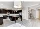 Modern kitchen features black cabinetry, granite countertops, and a large island at 313 Vista Glen St, Las Vegas, NV 89145