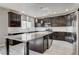 Bright kitchen with granite island, wine fridge, stainless appliances, and ample storage at 313 Vista Glen St, Las Vegas, NV 89145