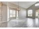 Spacious living room features lots of natural light, neutral colors, beautiful flooring, and modern lighting at 313 Vista Glen St, Las Vegas, NV 89145